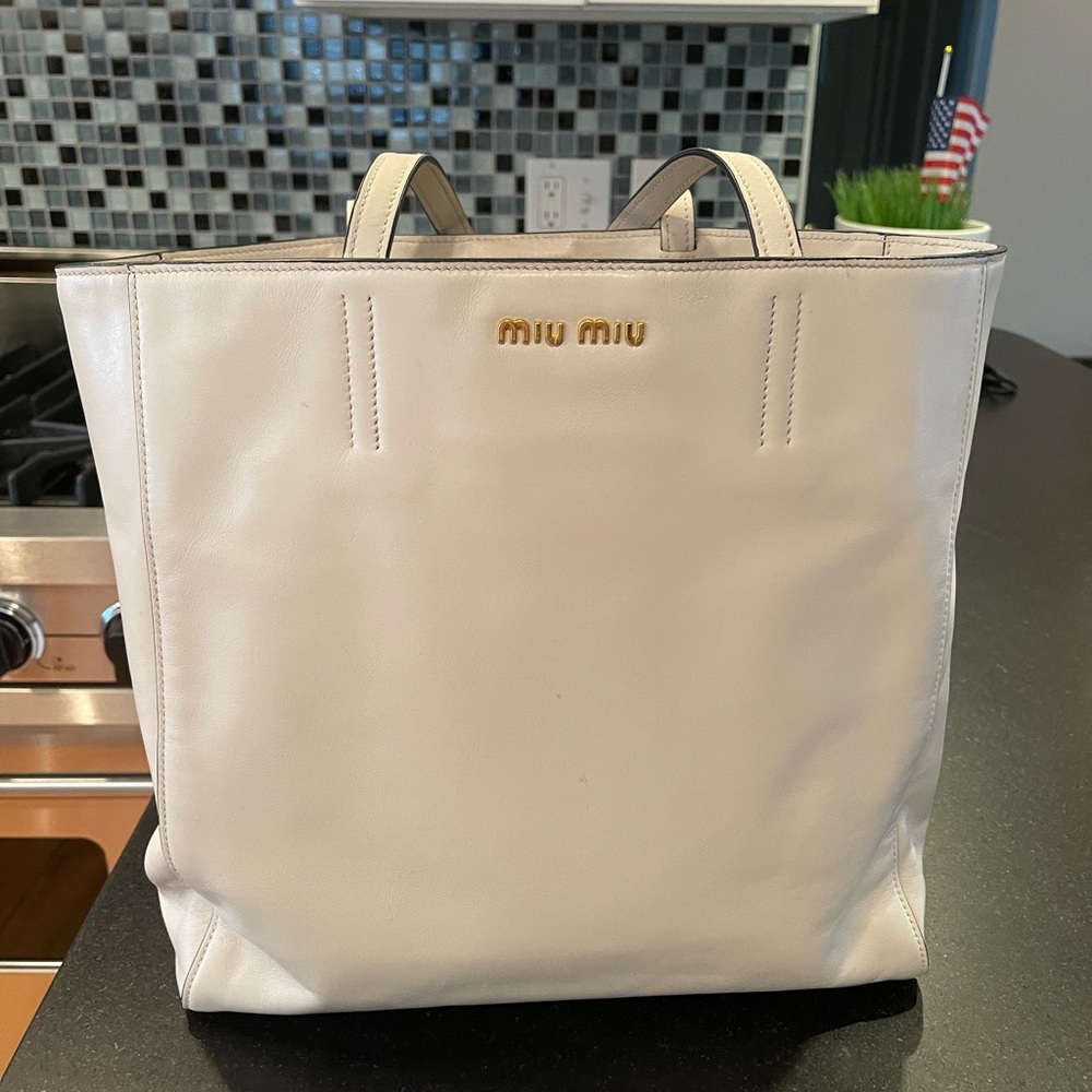 Miu Mui by Prada cream soft leather tote bag.